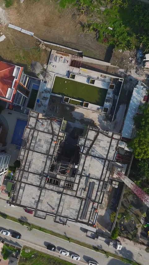 Vertical Video: Engineers Overseeing Construction Teams Working With Concrete Stock Footage 342598903