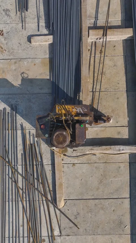 Vertical Video: Engineers Plan While Workers Build Walls, Use Metal, and Pour Stock Footage 342913311
