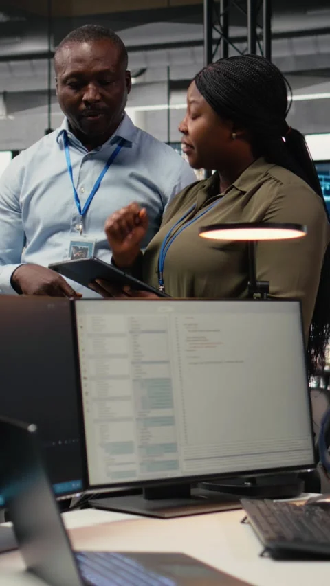 Vertical video Engineers in startup office work with artificial intelligence Stock Footage 323142521