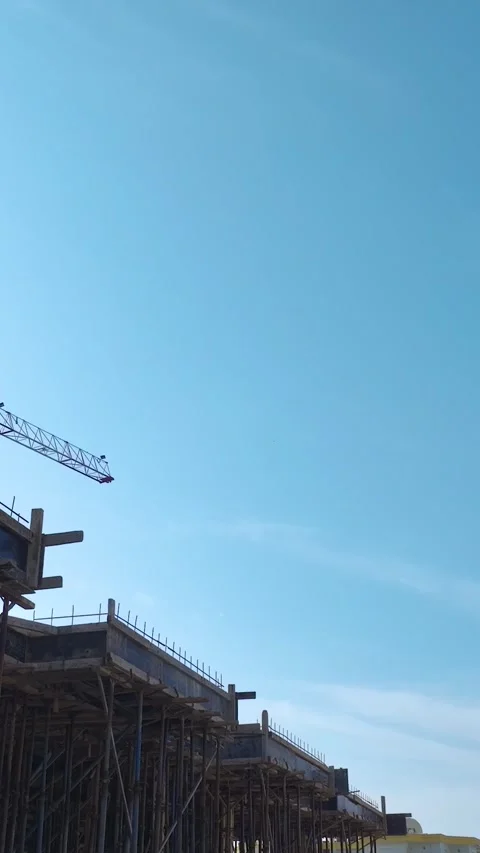 Vertical Video: Engineers Supervise Workers Building Walls and Handling Concrete Stock Footage 342602582