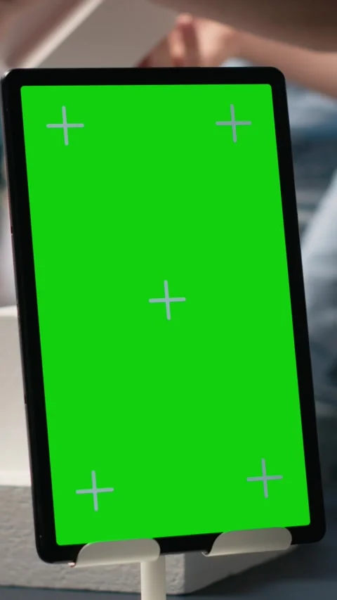 Vertical Video Engineers team share master plan ideas next to chroma key display Stock Footage 316339792