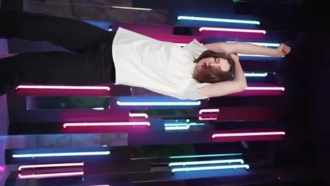 Vertical video - Enjoying the dance. Beautiful stylish woman having fun and Stock Footage 149584271