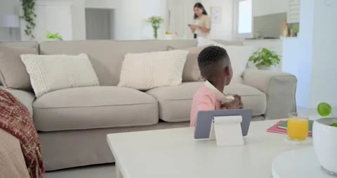 Vertical video: Entering dad kneeling, guiding child in pink tee using tablet Video stock 342802331