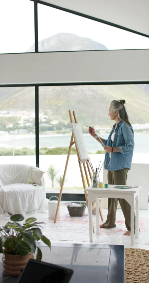 Vertical video: Entering studio, artist is dipping brush in green paint and Stock Footage 346718768