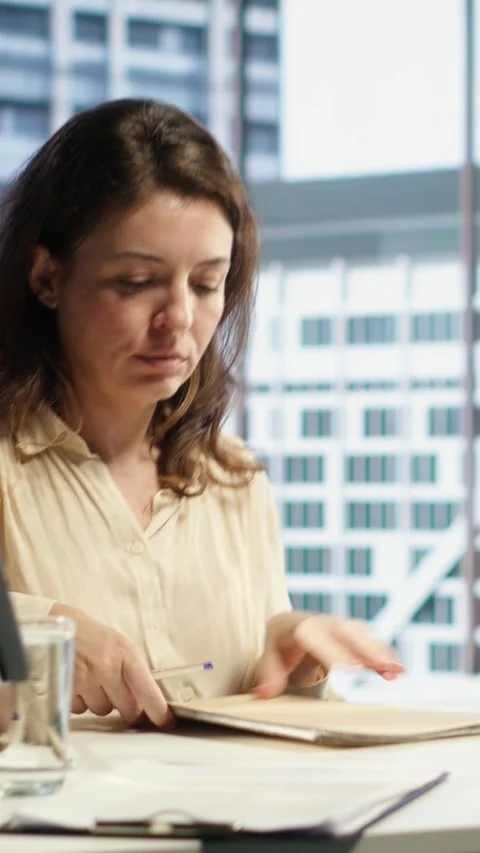 Vertical Video Enterprise director authorizing all work contracts and documents Video stock 283308680