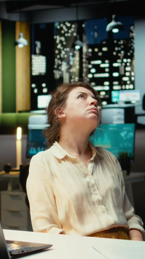 Vertical Video Entrepreneur contemplating on a complex problem in a dark office Stock Footage 317585741