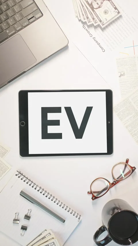 VERTICAL VIDEO OF EV DISPLAYING ON A TABLET SCREEN Stock Footage 308076687