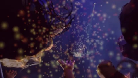 Vertical video: Event crowd reaching toward disco ball as gold particles Stock Footage 334112570