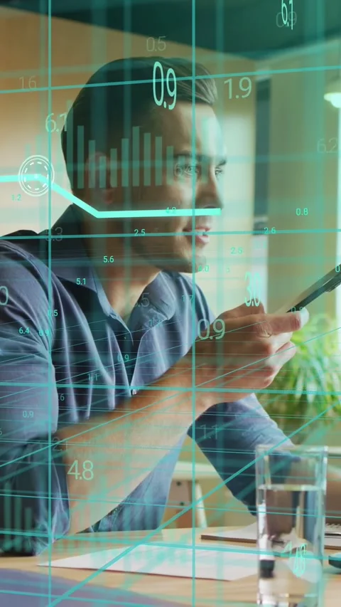 Vertical video: Exec raising phone speaking and checking notes, AR charts Stock Footage 333577021