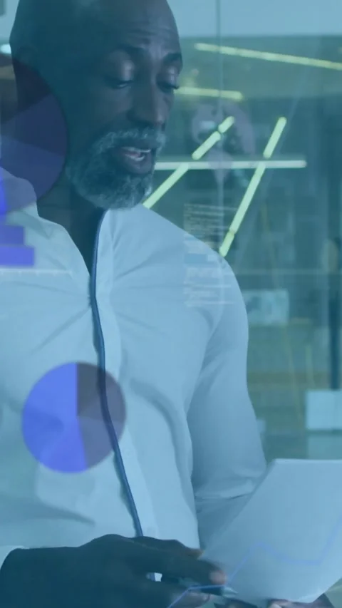 Vertical video: Exec reviewing doc and tapping phone, making biz charts react to Video stock 331030313