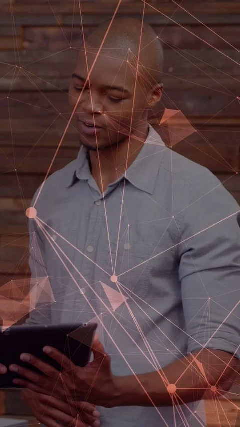 Vertical video: Exec tapping tablet, peer taking over showing tech data over Vídeo Stock 334704846