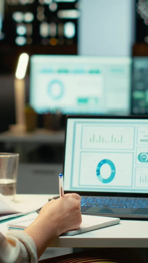 Vertical Video Executive is proofreading a report and documenting updates at Video stock 317519134