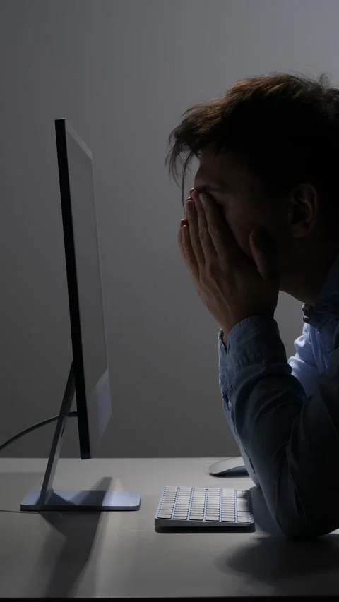 Vertical video exhausted person feeling overwhelmed and frustrated, sitting in Stock Footage 342673355