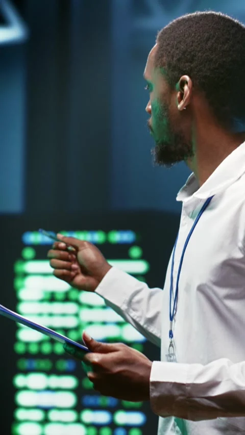 Vertical video Expert fixes server cybersecurity issues Stock Footage 245916579