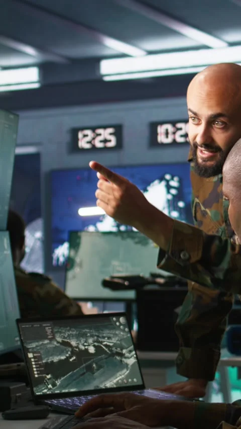 Vertical video Experts using tracking gear and radar systems in command center Video stock 281976240