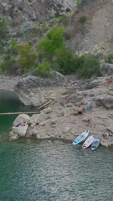 Vertical Video: Exploring a Beautiful Canyon by Paddleboard with Friends Stock Footage 297774035