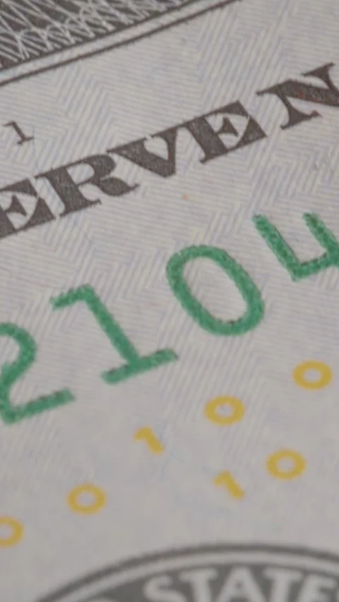 Vertical video Exploring the details of a United States dollar banknote with Stock Footage 327597231