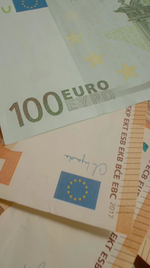 Vertical video Exploring euro banknotes and their unique features in everyday Video stock 327596936