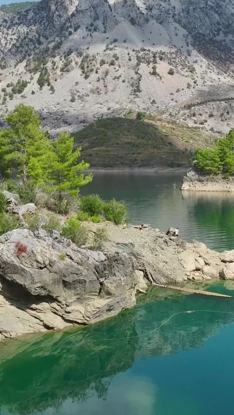 Vertical Video: Exploring a Magical Canyon by Paddleboard with People Floating Video stock 297767026