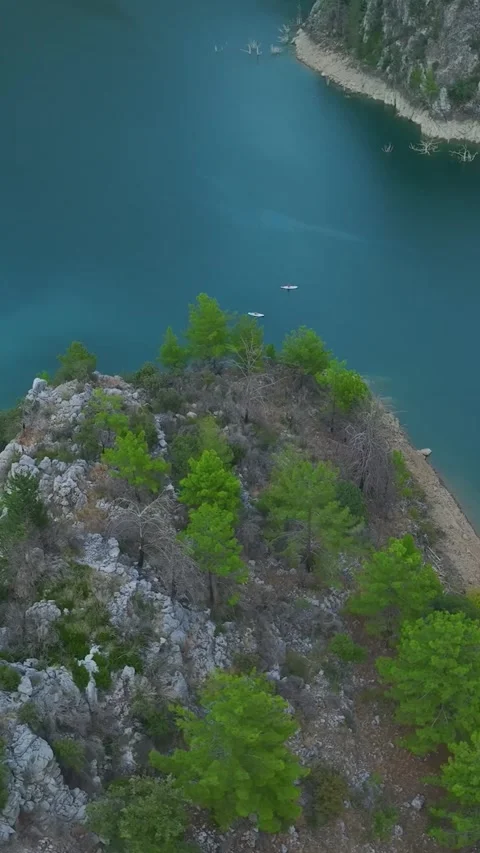 Vertical Video: Exploring a Scenic Canyon by Paddleboard with Friends Swimming Stock-Footage 297784205
