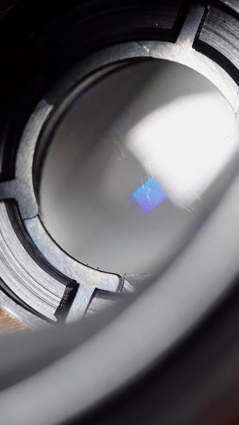 Vertical video extreme macro shot of aperture blades inside camera lens Stock Footage 345972584