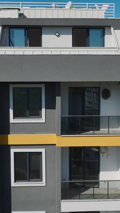 Vertical Video: Facade Installation and Stonework in Progress with Metal Stock Footage 297752659