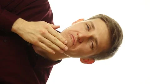 Vertical video of face of happy young handsome buisnessman thinking on isolated Stock Footage 148188351