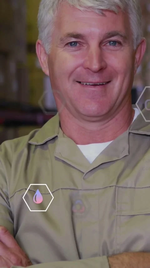 Vertical video: Factory tech standing arms folded while camera zooming, AR icons Stock Footage 334541304