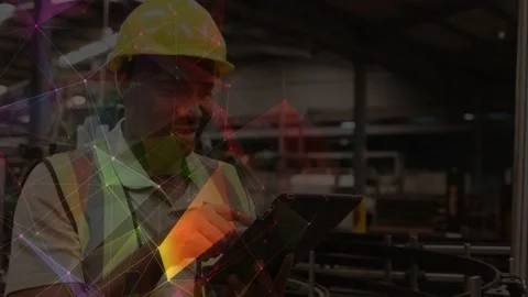 Vertical video: Factory tech tapping tablet and checking data while graphic Stock Footage 332731698