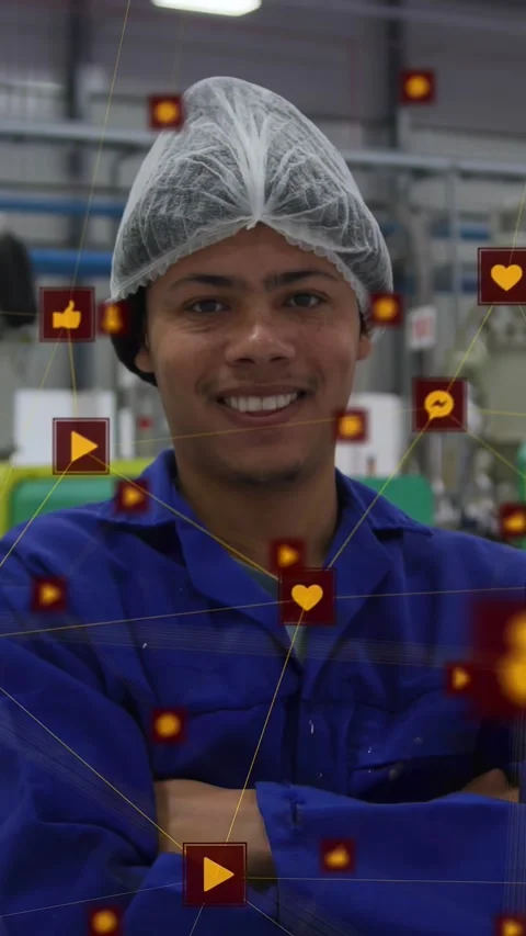 Vertical video: Factory worker posing crossed arms, orange icons shifting, Stock Footage 334423293