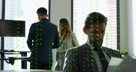 Vertical video: Falling binary overlay showing data, seated man reading docs in Stock Footage 333901078