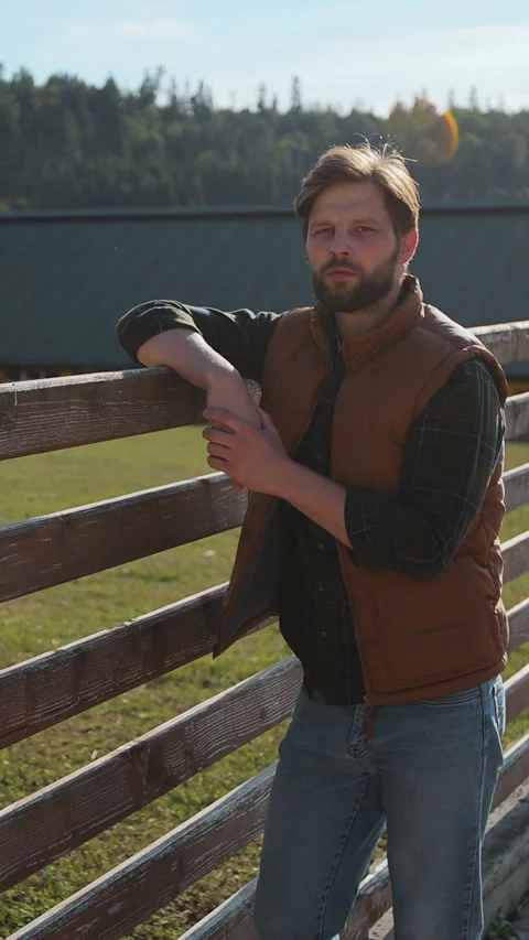 Vertical video. Farm Life: A Young Farmer Embracing the Beauty of Agriculture. Stock Footage 344630967