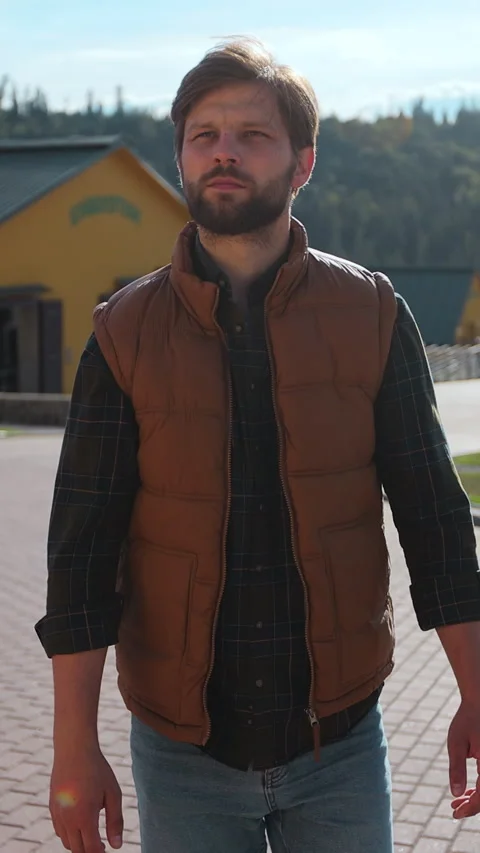 Vertical video. Farmer walking on ranch yard sunny day. Farming concept. Stock Footage 344630937