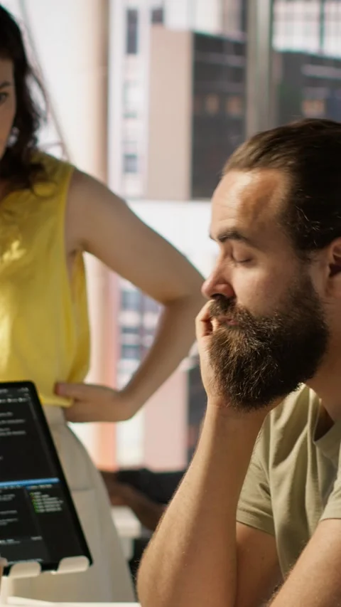 Vertical video Fatigued software engineer caught asleep at desk by manager Stock Footage 319483152