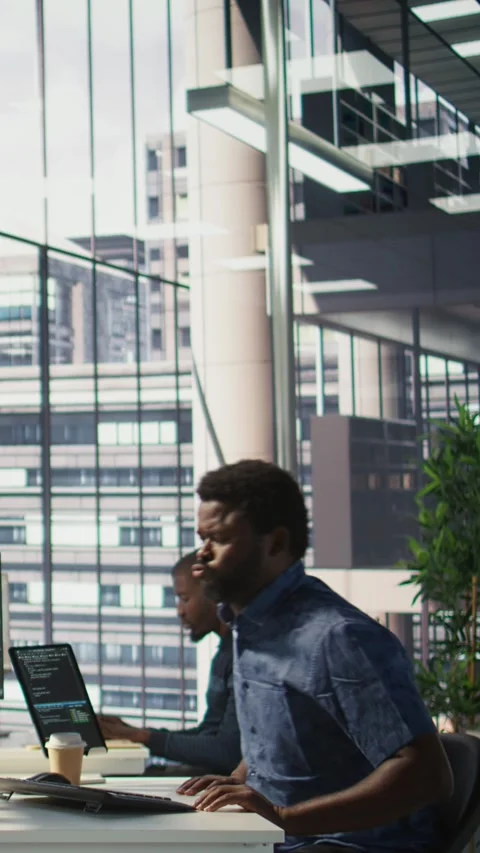 Vertical video Fatigued worker relaxing back, feeling strained after working Stock Footage 319491269