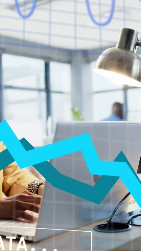 Vertical video: Female analyst typing at laptop, making data grid and finance Stock Footage 333181860