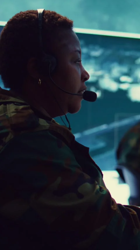 Vertical Video Female army operator registers important information from Stock Footage 277367483