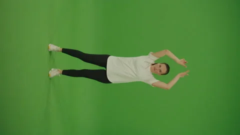 Vertical Video. Female Dancer Performing a Dance on Green Screen. Street Dancing Video stock 224152496