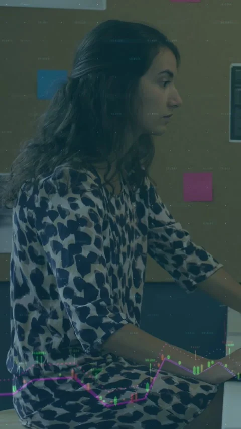 Vertical video: Female at desk in tech, typing and checking data while graph Stock Footage 333528343