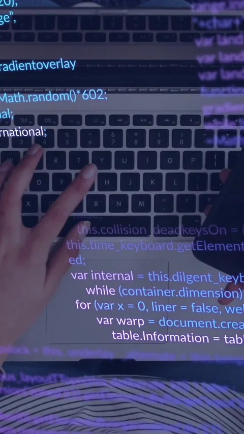 Vertical video: Female dev resting hands on keyboard causing code overlay, Stock Footage 331721439