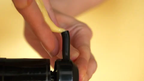 VERTICAL VIDEO. Female hands squeeze out the shampoo gel using black dispenser Stock Footage 153209858