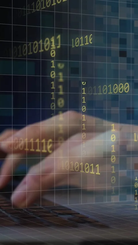 Vertical video: Female hands typing, first key sparking tech grid, 0s 1s over Stock Footage 334530175