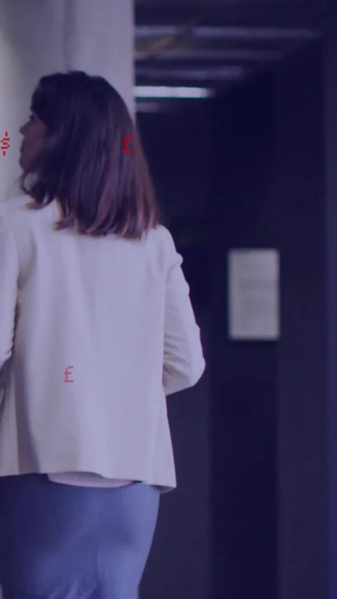 Vertical video: Female office worker walking with folder hearing noise glancing Stock Footage 330260232