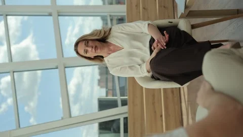 Vertical video of a female psychologist during a consultation with a client Stock Footage 323915280