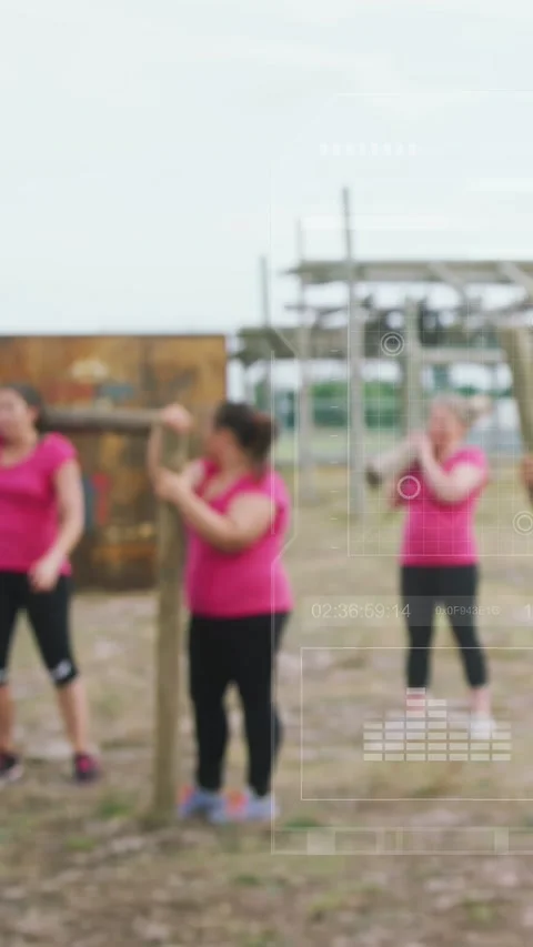 Vertical video: Female team getting coach cue, bracing post in fitness as data Stock Footage 333260093