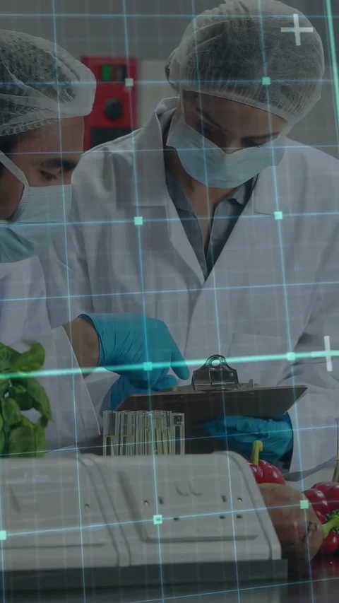 Vertical video: Female tech noting log while male tapping barcode AR grid Stock Footage 331077511