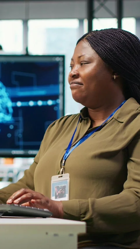 Vertical video Female technician using computer to write code, developing Stock Footage 312709352