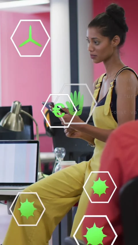 Vertical video: Female worker tapping device, causing green hex icons and code, Stock Footage 334386076