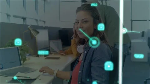 Vertical video: Female worker typing on laptop, initiating teal node overlay, Stock Footage 333425606