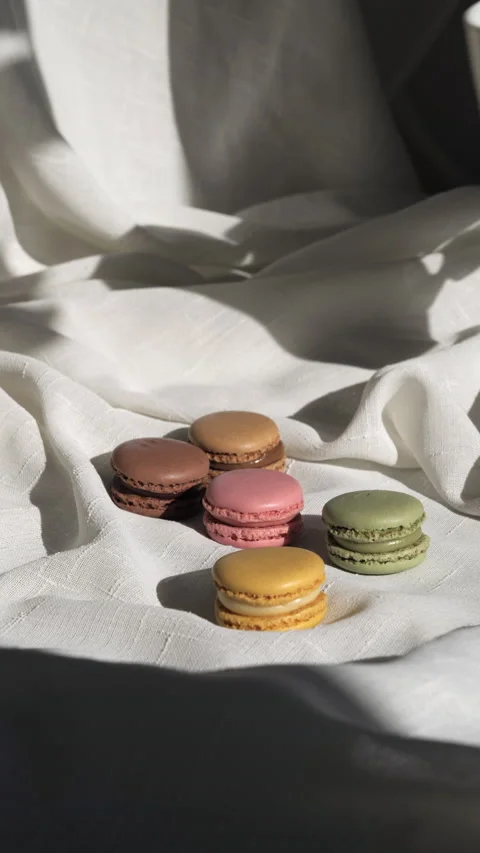 Vertical video of a few macaroons and a mug Stock Footage 233255764